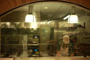 chefs busy making pizza